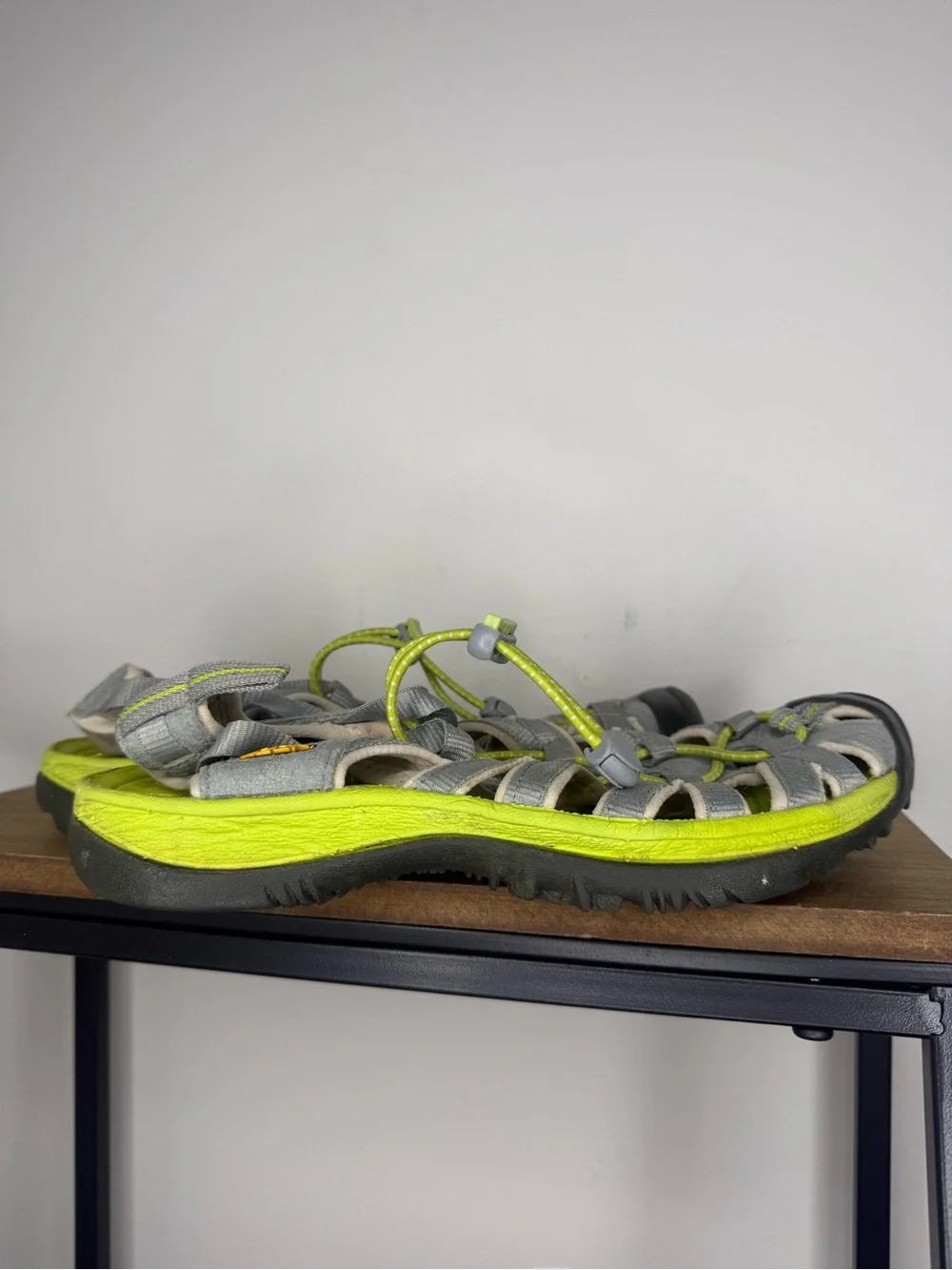 women's Keen Whisper sandals in a neutral gray and bright green colorway